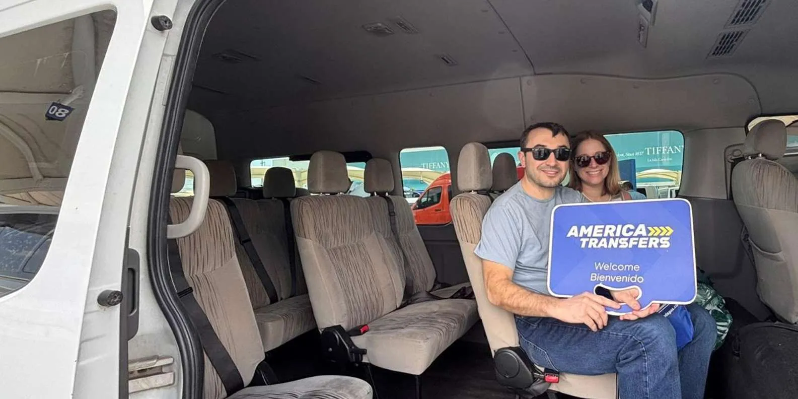 Passengers seated in an America Transfers van