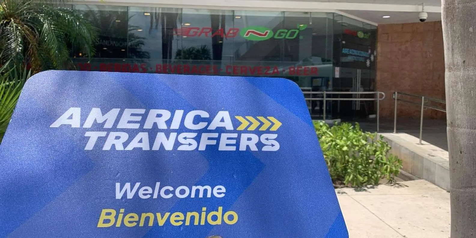 America Transfers sign at a hotel pickup